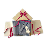 Set of scarves in a gift box with a pink ribbon on a white background. 
Hand-painted silk cotton blend scarf by Otta-Italy, 67 x 193 cm, featuring 
blue, gray and orange shades. Luxury Italian pure silk accessory, soft, fresh and lightweight scarf for women and men.
