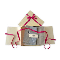 Set of scarves in a gift box with a pink ribbon on a white background. 
Hand-painted silk cotton blend scarf by Otta-Italy, 70 x 190 cm, featuring 
gray, purple and orange shades. Luxury Italian pure silk accessory, soft, fresh and lightweight scarf for women and men.
