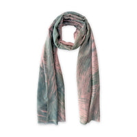 A hand-painted Otta silk cotton blend scarf on a white background, in 
pink and green shades, loosely looped to showcase its full length and delicate texture. Lightweight artisan accessory with hand-fringed edges, measuring 70 x 190 cm.
