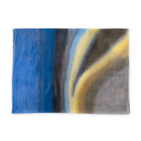 Pure cashmere hand-painted scarf by Otta-Italy flat lay on a white background. Elegant blue, yellow, orange, gray and brown shades. 67x195 cm.
