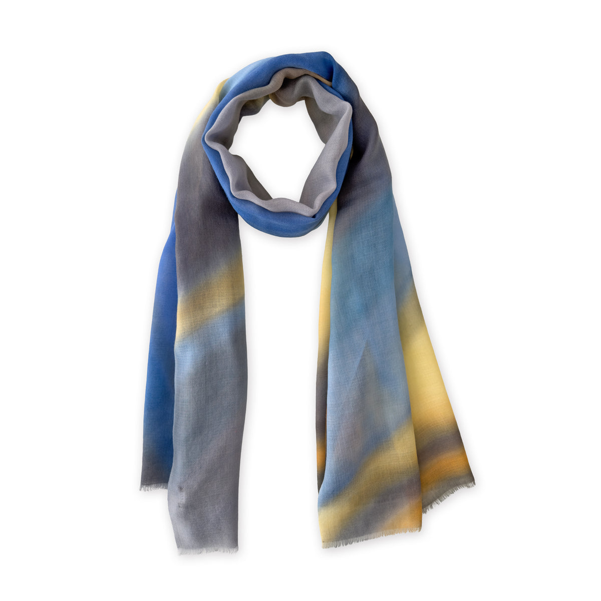 Loosely looped hand-painted Otta cashmere scarf on a white background, showcasing its warm texture and length. 67x195 cm.
