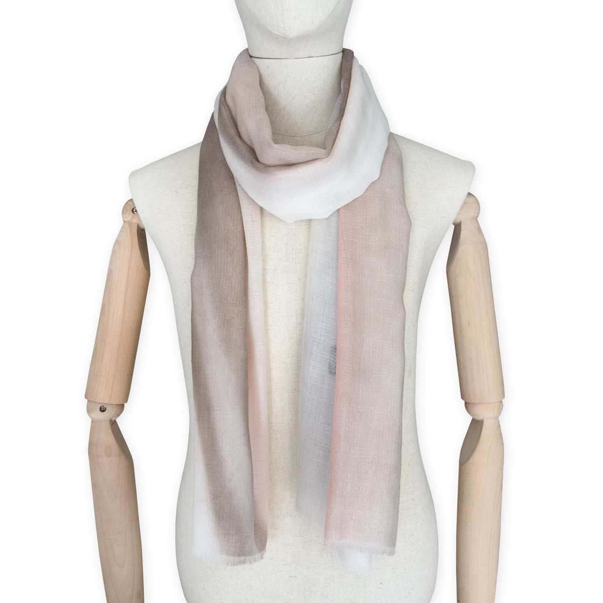 Mannequin wearing scarf on a white background. Hand-painted pure cashmere scarf by Otta-Italy, 66 x 200 cm, featuring light gray, beige, pink and brown. Luxury Italian cashmere accessory, soft and warm scarf for women and men.
