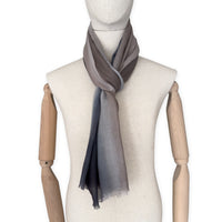 Mannequin wearing scarf on a white background. Hand-painted pure cashmere scarf by Otta-Italy, 67 x 200 cm, featuring dark gray and brown. Luxury Italian cashmere accessory, soft and warm scarf for women and men.
