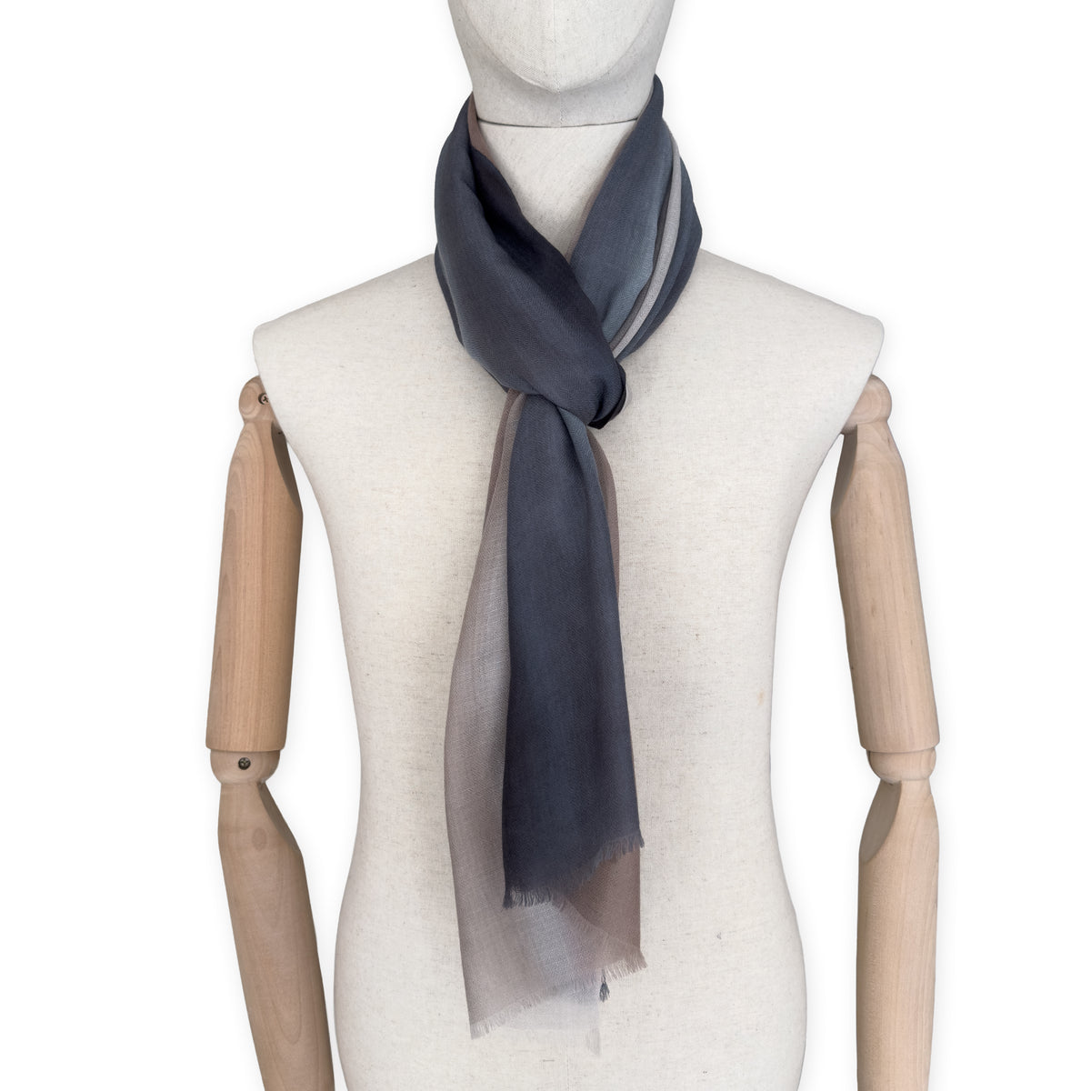 Mannequin wearing scarf on a white background. Hand-painted pure cashmere scarf by Otta-Italy, 67 x 200 cm, featuring dark gray and brown. Luxury Italian cashmere accessory, soft and warm scarf for women and men.
