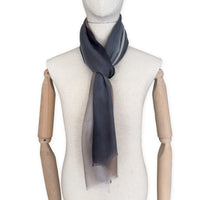 Mannequin wearing scarf on a white background. Hand-painted pure cashmere scarf by Otta-Italy, 67 x 200 cm, featuring dark gray and brown. Luxury Italian cashmere accessory, soft and warm scarf for women and men.
