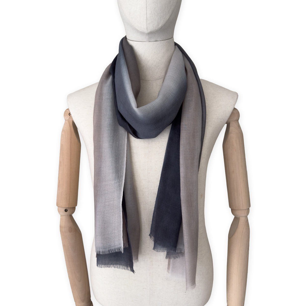 Mannequin wearing scarf on a white background. Hand-painted pure cashmere scarf by Otta-Italy, 67 x 200 cm, featuring dark gray and brown. Luxury Italian cashmere accessory, soft and warm scarf for women and men.
