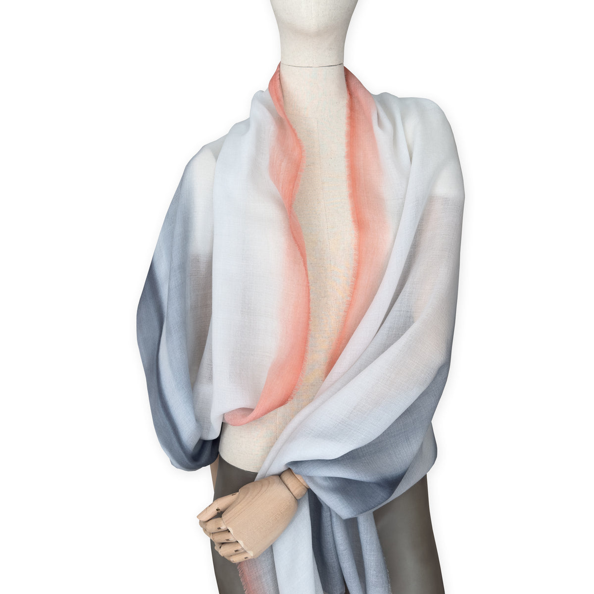 Mannequin wearing scarf on a white background. Hand-painted pure cashmere scarf by Otta-Italy, 66 x 198 cm, featuring grey and coral. Luxury Italian cashmere accessory, soft and warm scarf for women and men.
