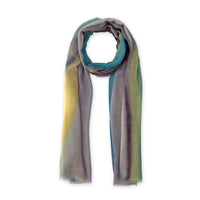 A hand-painted Otta pure cashmere scarf on a white background, in 
green, yellow, gray and brown shades, loosely looped to showcase its full length and delicate texture. Lightweight artisan accessory with hand-fringed edges, measuring 68 x 202 cm.
