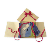Set of scarves in a gift box with a pink ribbon on a white background. 
Hand-painted linen scarf by Otta-Italy, 34 x 192 cm, featuring 
blue, midnight blue, indigo, light blue, green. Luxury Italian pure linen accessory, soft, fresh and lightweight scarf for women and men.
