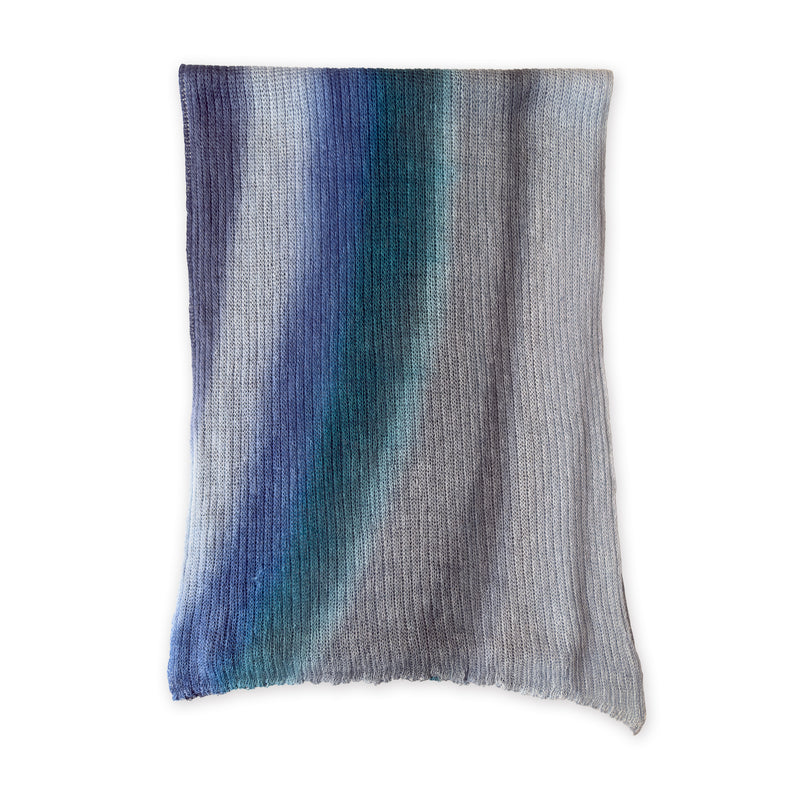 Multicolored linen scarf on a white background. Hand-painted linen scarf by Otta-Italy, 32 x 200 cm, featuring blue, midnight blue, light blue, turquoise and indigo shades of colors. Luxury Italian linen, soft and lightweight scarf for women and men.
