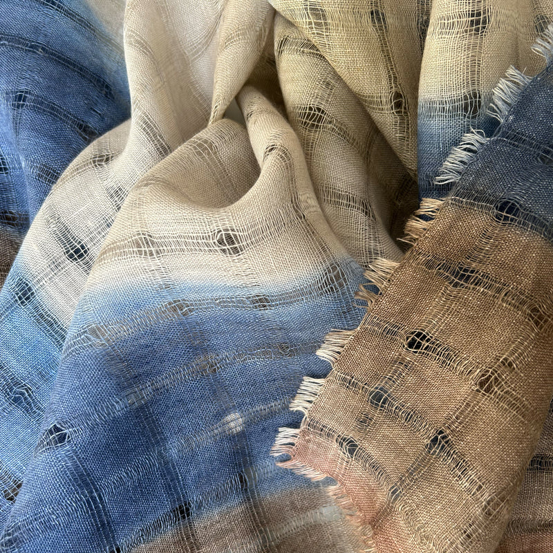 Close-up of a hand-painted Otta-Italy pure linen scarf showcasing its premium open-weave texture with delicate hand-fringed edges and hand-hemmed borders.
