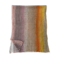Knitted blanket with multicolor stripes on a white background. linen-scarf-hand-painted-28x192cm-brown-pastel pink-orange-yellow-otta-italy
