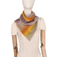 Mannequin wearing a colorful scarf on a white background. linen-scarf-hand-painted-28x192cm-brown-pastel pink-orange-yellow-otta-italy
