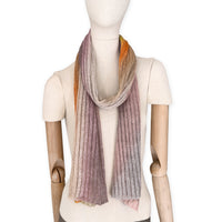 Mannequin wearing a multicolored scarf on a white background. linen-scarf-hand-painted-28x192cm-brown-pastel pink-orange-yellow-otta-italy
