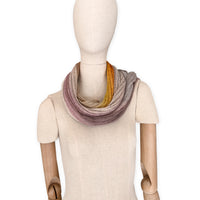 Mannequin wearing a multicolored scarf on a white background. linen-scarf-hand-painted-28x192cm-brown-pastel pink-orange-yellow-otta-italy
