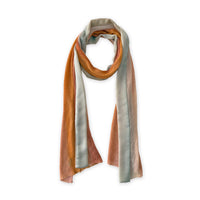 Hand-painted Otta pure linen scarf in 
coral, orange, gray, and champagne, loosely looped to showcase its full length and delicate texture in white background. Lightweight artisan accessory with hand-sewn edges, measuring 37 x 196 cm.
