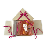 Set of scarves in a gift box with a pink ribbon on a white background. 
Hand-painted linen scarf by Otta-Italy, 37 x 196 cm, featuring 
coral, orange, gray, and champagne. Luxury Italian pure linen accessory, soft, fresh and lightweight scarf for women and men.
