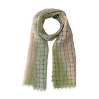 Hand-painted Otta pure linen scarf in 
green and beige, loosely looped to showcase its full length and delicate texture in white background. Lightweight artisan accessory with hand-sewn edges, measuring 48 x 190 cm.
