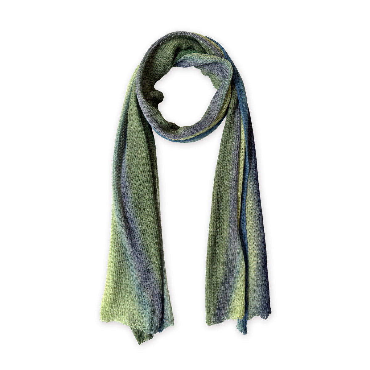 Colorful linen scarf in green and blue shades on a white background. t is hand-painted scarf in measures 35 x 202 cm by otta-italy scarves brand. Luxury Italian linen accessory, soft and lightweight scarf for women and men.
