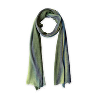 Colorful linen scarf in green and blue shades on a white background. t is hand-painted scarf in measures 35 x 202 cm by otta-italy scarves brand. Luxury Italian linen accessory, soft and lightweight scarf for women and men.

