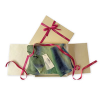 Set of scarves in a gift box with a pink ribbon on a white background. 
Hand-painted linen scarf by Otta-Italy, 35 x 202 cm, featuring green and blue colors. Luxury Italian linen scarf, soft and lightweight scarf for women and men.
