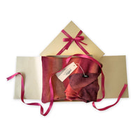 Set of scarves in a gift box with a pink ribbon on a white background. 
Hand-painted linen scarf by Otta-Italy, 32 x 200 cm, featuring red, coral and brown colors. Luxury Italian linen scarf, soft and lightweight scarf for women and men.
