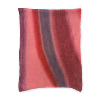 Hand-painted Otta pure linen scarf in 
red and purple, loosely looped to showcase its full length and delicate texture in white background. Lightweight artisan accessory with hand-sewn edges, measuring 33 x 205 cm.
