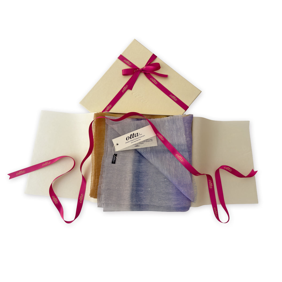 Luxury gift box with a pink ribbon containing a hand-painted Otta-Italy linen silk blend scarf on a white background.

