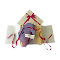 Set of scarves in a gift box with a pink ribbon on a white background. 
Hand-painted linen scarf by Otta-Italy, 52 x 200 cm, featuring 
yellow, purple and lilac. Luxury Italian pure linen accessory, soft, fresh and lightweight scarf for women and men.
