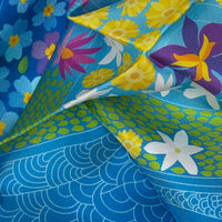 Close-up of an exclusive Otta silk twill scarf showcasing vibrant printed details of Primavera Persiana Blue