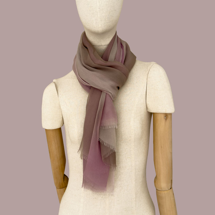 Mannequin wearing a hand-painted pure silk organza scarf by Otta-Italy, pink background. Pink, beige and brown. 79 x 168 cm.
