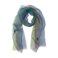 Loosely looped hand-painted Otta pure silk organza scarf on a white background, showcasing its sheer texture and length. 45x180 cm. With delicate hand-fringed edges.
