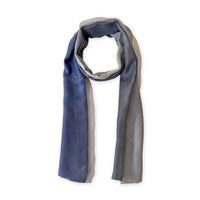 Gradient scarf on a white background. Hand-painted pure silk scarf by Otta-Italy, 24 x 168 cm, featuring gray and midnight blue. Luxury Italian silk accessory, soft and lightweight scarf for women and men.
