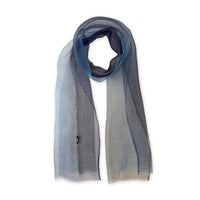 Gradient scarf on a white background. Hand-painted pure silk scarf by Otta-Italy, 50 x 200 cm, featuring gray, midnight blue and blue. Luxury Italian silk accessory, soft and lightweight scarf for women and men.
