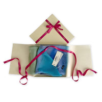 Set of scarves in a gift box with a pink ribbon on a white background. 
Hand-painted silk scarf by Otta-Italy, 65 x 175 cm, featuring 
blue, green and gray shades. Luxury Italian pure silk accessory, soft, fresh and lightweight scarf for women and men.
