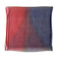 Colorful silk scarf in red and blue shades on a white background. t is hand-painted scarf in measures 48 x 194 cm by otta-italy scarves brand. Luxury Italian silk accessory, soft and lightweight scarf for women and men.
