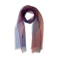Multicolored silk scarf on a white background. Hand-painted silk scarf by Otta-Italy, 48 x 194 cm, featuring red and blue shades of colors. Luxury Italian silk, soft and lightweight scarf for women and men.
