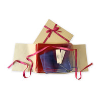 Set of scarves in a gift box with a pink ribbon on a white background. 
Hand-painted silk scarf by Otta-Italy, 48 x 194 cm, featuring red and blue colors. Luxury Italian silk scarf, soft and lightweight scarf for women and men.
