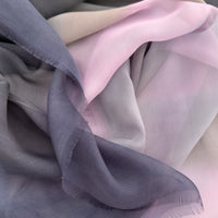 Close-up of fabric. Hand-painted silk scarf by Otta-Italy, 177 x 65 cm, featuring gray and pink colors. Luxury Italian silk scarf, soft and lightweight scarf for women and men.
