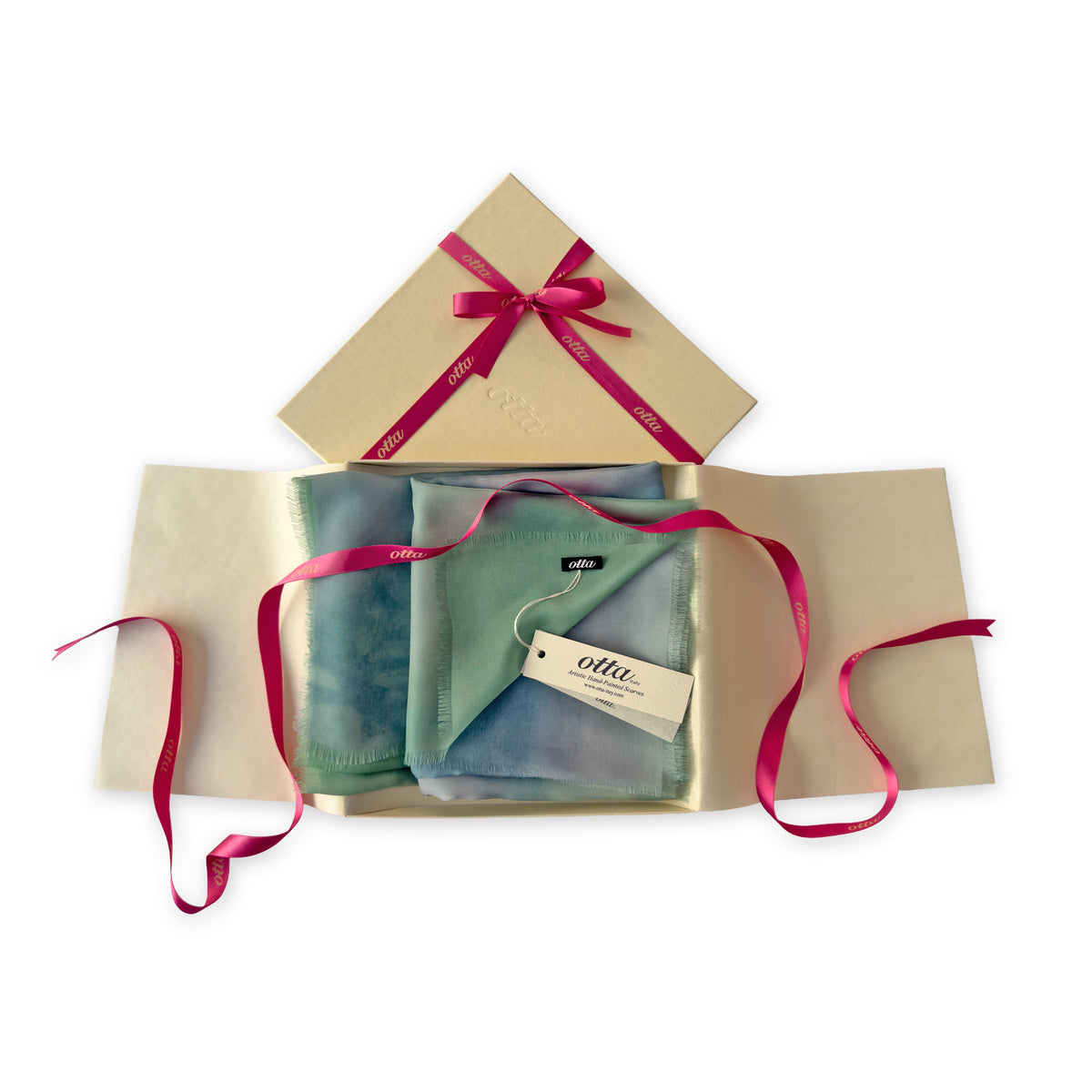 Set of scarves in a gift box with a pink ribbon on a white background. 
Hand-painted silk scarf by Otta-Italy, 65 x 175 cm, featuring 
green and blue. Luxury Italian pure silk accessory, soft, fresh and lightweight scarf for women and men.
