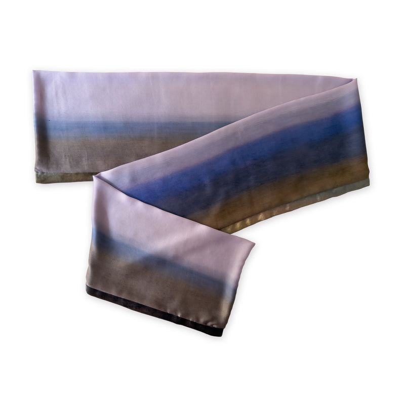 Multicolored silk scarf on a white background. Hand-painted silk scarf by Otta-Italy, 171 x 24 cm, featuring blue, lilac and brown shades of colors. Luxury Italian silk, soft and lightweight scarf for women and men.

