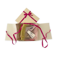 Set of scarves in a gift box with a pink ribbon on a white background. 
Hand-painted silk scarf by Otta-Italy, 65 x 175 cm, featuring 
pink, yellow and brown shades. Luxury Italian pure silk accessory, soft, fresh and lightweight scarf for women and men.
