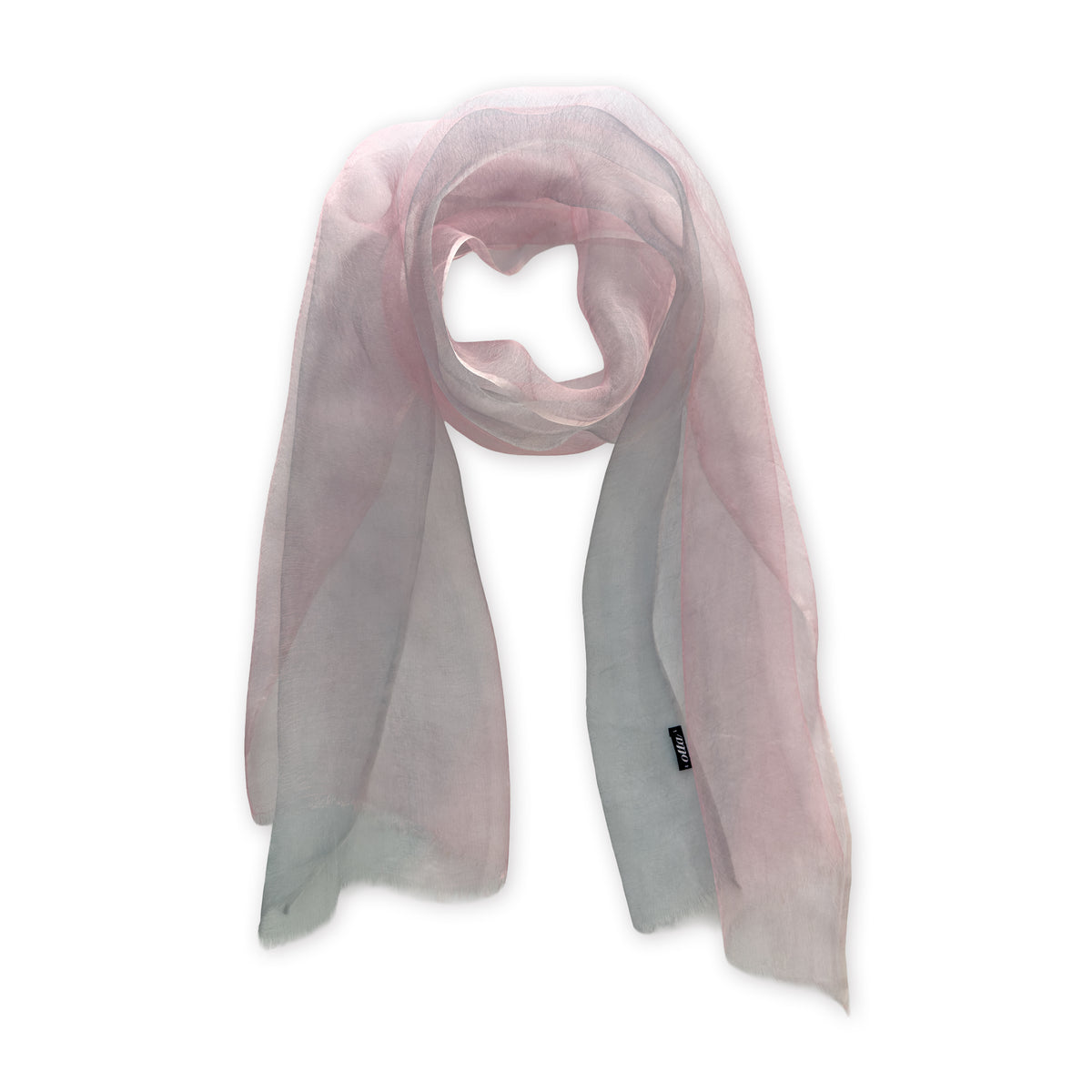 Hand-painted Otta silk scarf in 
pink and light gray, loosely looped to showcase its full length and delicate texture in white background. Lightweight artisan accessory with hand-fringed edges, measuring 50 x 200 cm.

