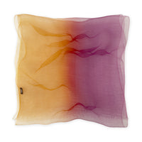 Hand-painted pure silk organza scarf by Otta-Italy flat lay on a white background. Orange, red and pink luxury accessory. With delicate hand-fringed edges.

