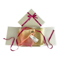 Set of scarves in a gift box with a pink ribbon on a white background. 
Hand-painted silk scarf by Otta-Italy, 65 x 175 cm, featuring 
coral, peach, yellow and light green shades. Luxury Italian pure silk accessory, soft, fresh and lightweight scarf for women and men.
