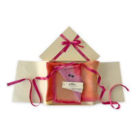 Set of scarves in a gift box with a pink ribbon on a white background. 
Hand-painted silk scarf by Otta-Italy, 65 x 175 cm, featuring 
