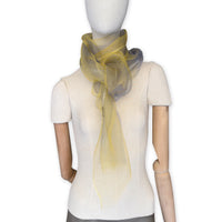 Mannequin wearing a colorful and lightweight silk scarf on a white background. Silk scarf is in shades of yellow and gray colors. It is hand-painted scarf in measures 50 x 194 cm by otta-italy scarves brand.
