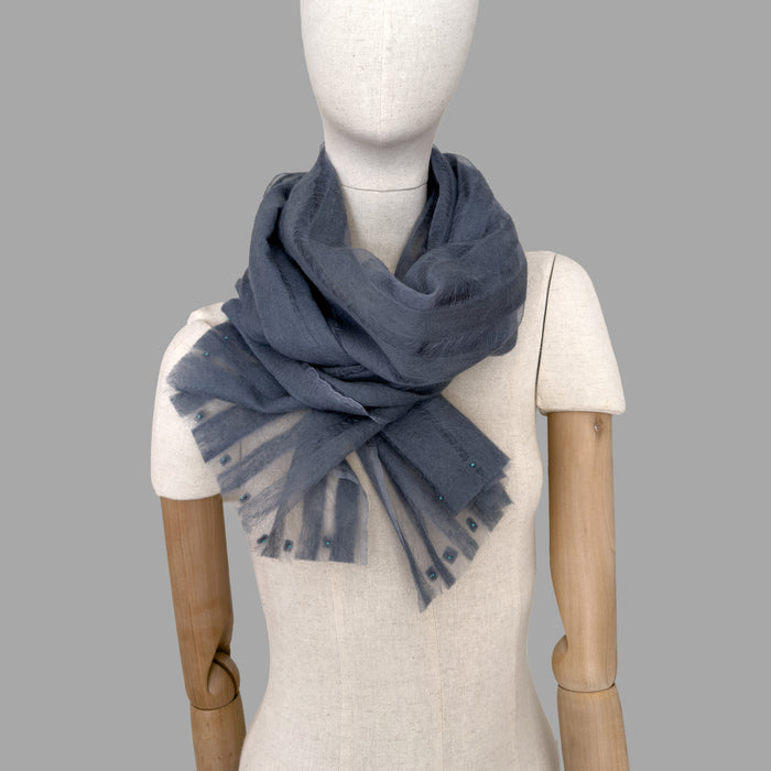 Mannequin wearing scarf on a beige background. Hand-painted silk scarf with hand-needle felted wool by Otta-Italy, 40 x 176 cm, featuring 
gray. Luxury Italian pure silk accessory, soft, fresh and lightweight scarf for women and men.
