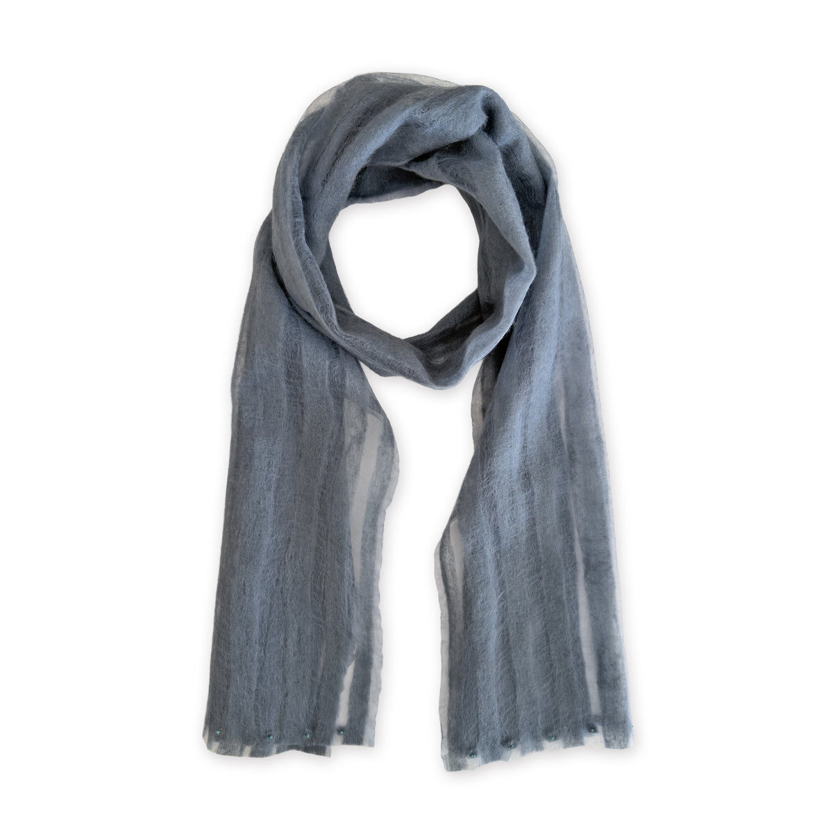 A hand-painted Otta pure silk with hand-needle felted wool scarf on a white background, in 
gray shades, loosely looped to showcase its full length and delicate texture. Lightweight artisan accessory with hand-fringed edges, measuring 40 x 176 cm.
