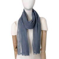 Mannequin wearing a hand-painted Otta pure silk with hand-needle felted wool scarf on a white background in 
gray tones. soft, fresh and lightweight, and elegant accessory measuring 40 x 176 cm. Unique artisan scarf with hand-fringed edges, perfect for women and men.
